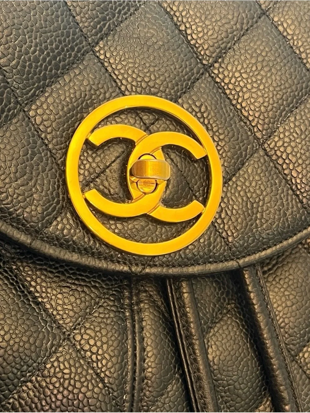 CHANEL Black Quilted Leather Backpack with Gold CC Accent